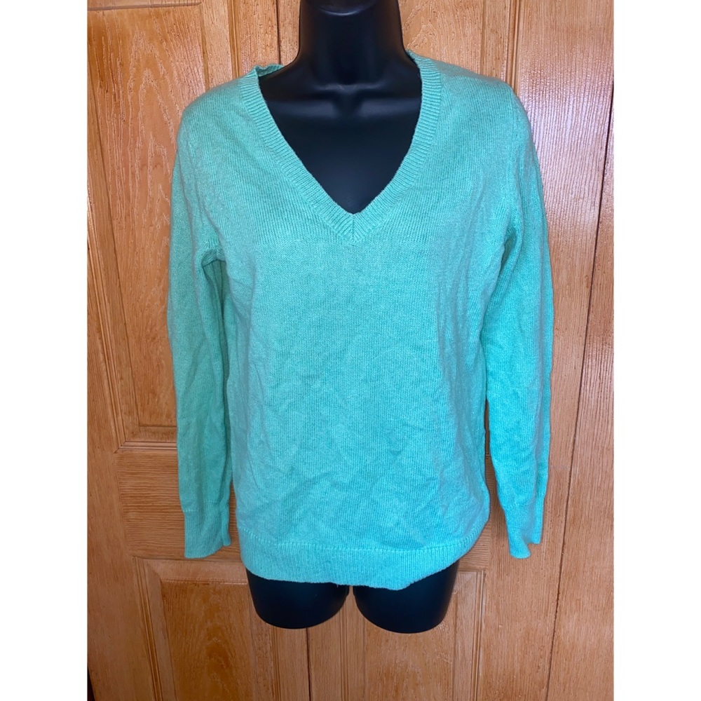 Light green long sleeved sweater.